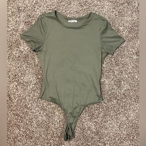 Very pretty hunter green. Body suit looks great with jeans or jean shorts.